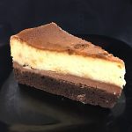 White chocolate cheesecake on a crust that's actually a giant brownie.