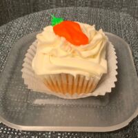 Carrot cupcake with cream cheese frosting and a buttercream carrot. Carrot