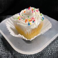Vanilla cupcake with vanilla butter cream frosting and seasonal sprinkles. Vanilla Vanilla