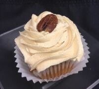 A maple pecan cupcake, topped with brown sugar cream cheese and finished with a full pecan. Butter Pecan