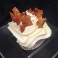 A bacon poundcake topped with cream cheese and bacon pieces. Bacon Pound