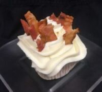 A bacon poundcake topped with cream cheese and bacon pieces. Bacon Pound