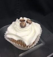 A vanilla cupcake with mini chocolate chips filled with a cookie dough filling, topped with vanilla buttercream and finished off with three cookie dough candy pieces. Cookie Dough