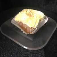 An eggnog cupcake with a white chocolate eggnog ganache filing, topped with eggnog cream cheese, drizzled with eggnog and finished with a sprinkle of nutmeg. Egg Nog