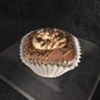 A cupcake made with peanut butter oreos, filled with peanut butter and crushed oreo cookies, iced in rich peanut butter and decadent chocolate buttercreams, and drizzled with peanut butter before being topped with even more oreo pieces. Peanut Butter Oreo